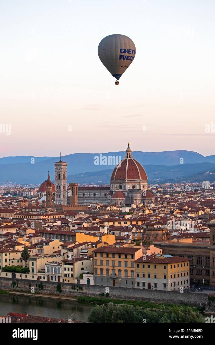 Florence cathedral and sunrise over the city with a Hot air balloon Florence, Italy August 2023, City of Florence in the background Stock Photo