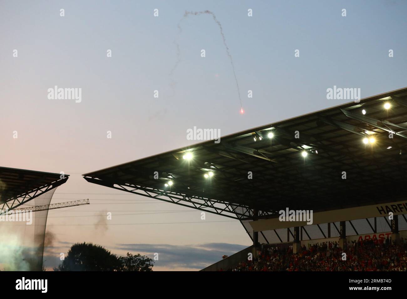 Essen, Germany, 27.08.2023. Rot-Weiss Essen vs. SC Preussen Muenster, Football, 3. Liga, Matchday 4, Season 2023/2024.  Fireworks launched inside the stadium by SC Preussen Muenster Fans   DFL REGULATIONS PROHIBIT ANY USE OF PHOTOGRAPHS AS IMAGE SEQUENCES AND/OR QUASI-VIDEO.  Credit: newsNRW / Alamy Live News Stock Photo