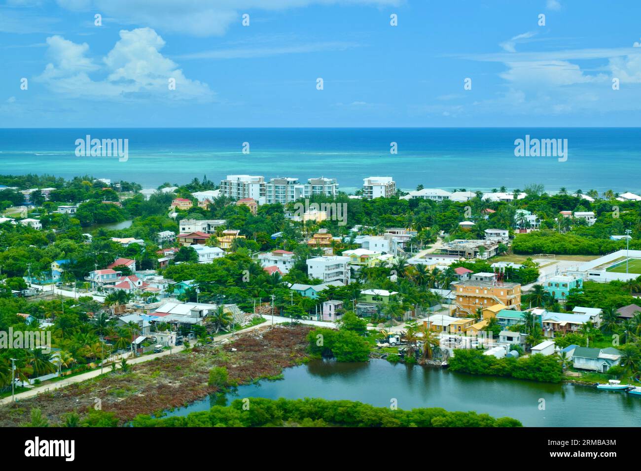 A view from a small plane of San Pedro, Ambergris Caye, Belize. The Caribbean Sea can be seen in the background. Stock Photo