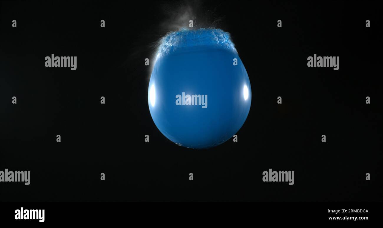 Water Getting Shot Shot breaking water filled blue hi-res stock photography and images - Alamy