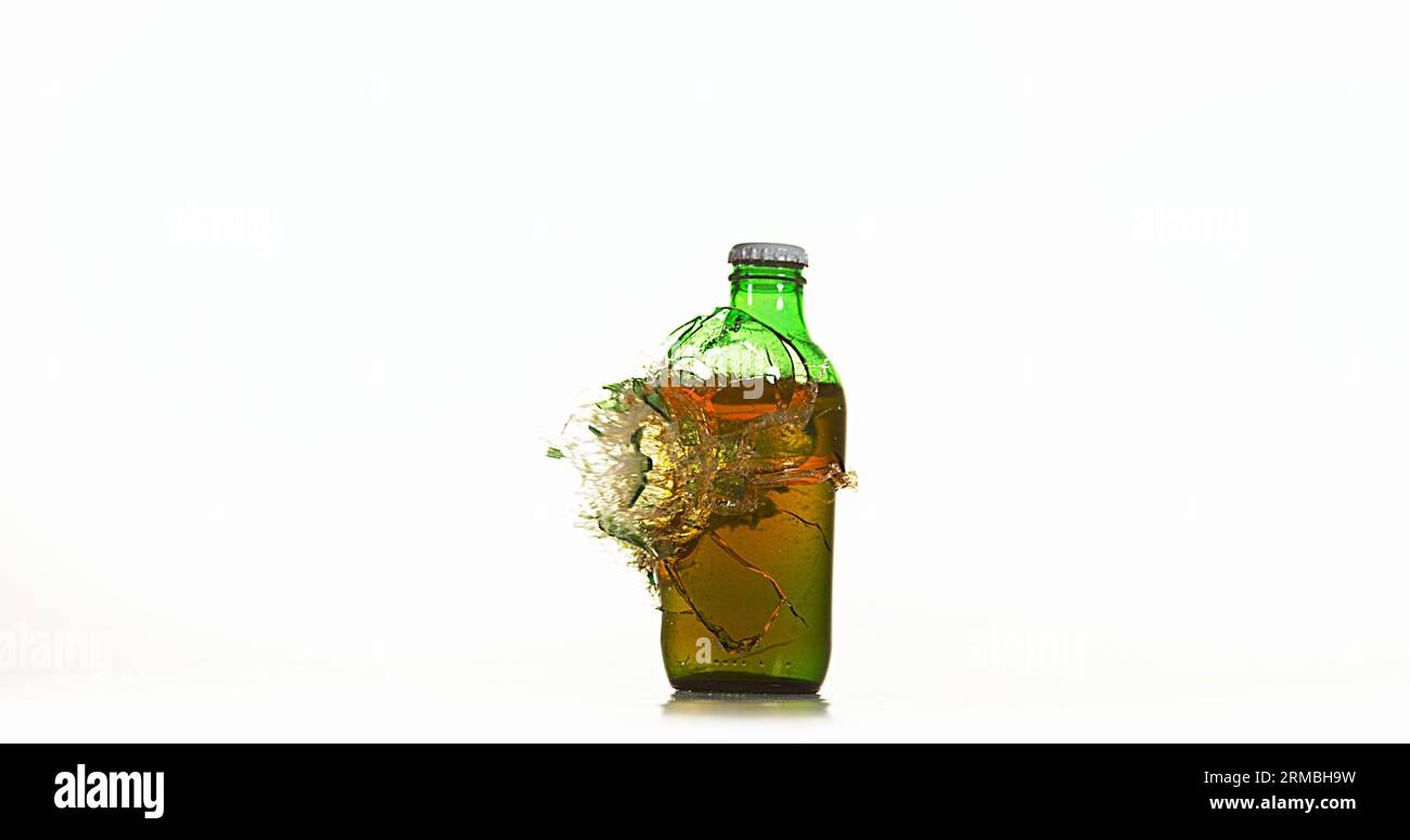 Bottle of Beer Breaking and Splashing against White Background Stock Photo Alamy