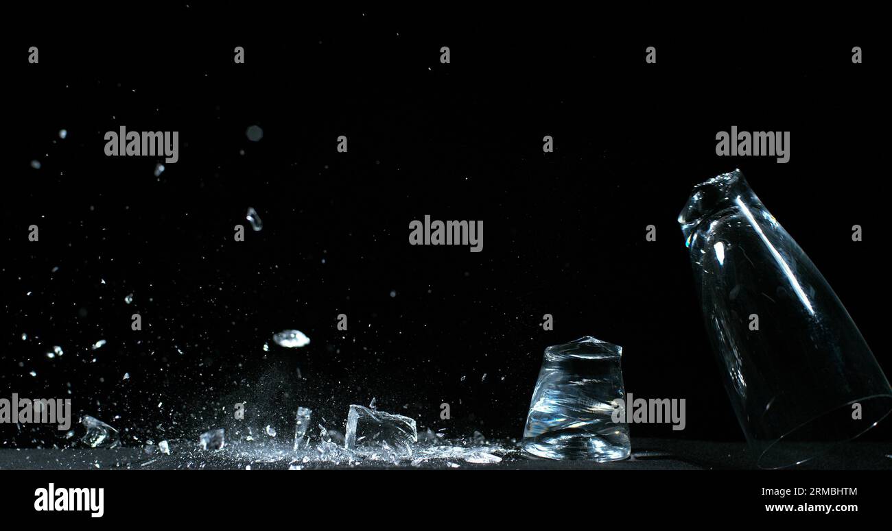 Glass Falling and exploding on Black Background Stock Photo Alamy