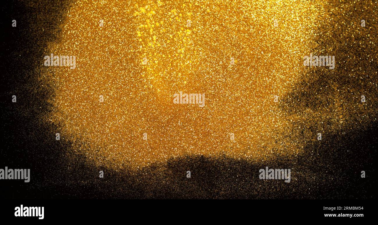 Gold Glitter Falling on Black Background Stock Photo - Alamy