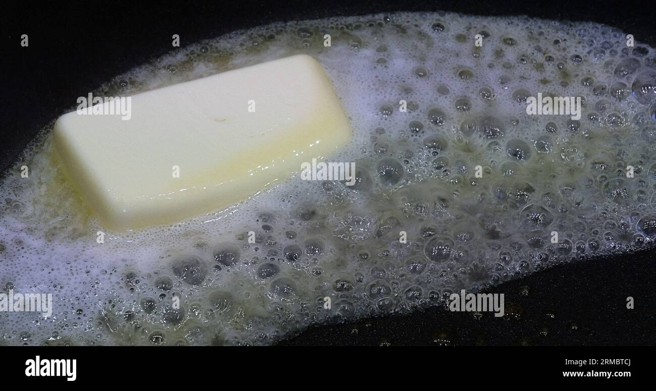 Butter that melts and crackles in a stove Stock Photo - Alamy