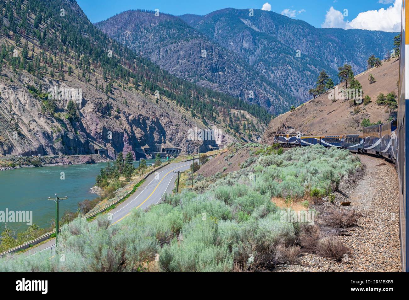 Rocky Mountaineer train and locomotive along Fraser River, British Columbia, Canada. Stock Photo
