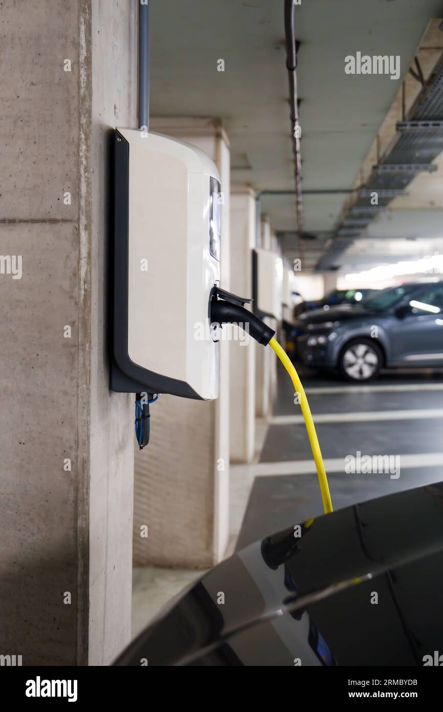 Recharging electric cars at the charging station in the underground ...
