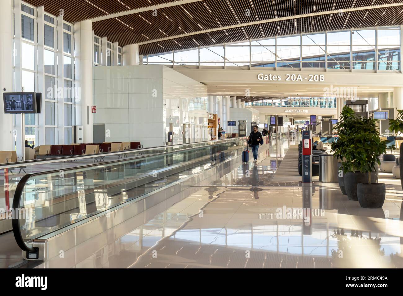 Bahrain airport interior - gates, travelators, waiting area Stock Photo