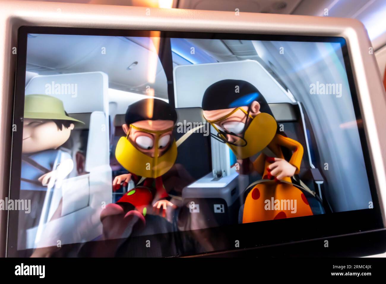 Personal television, PTV in front of an airplane seat showing instructions on FlyDubai flight Stock Photo