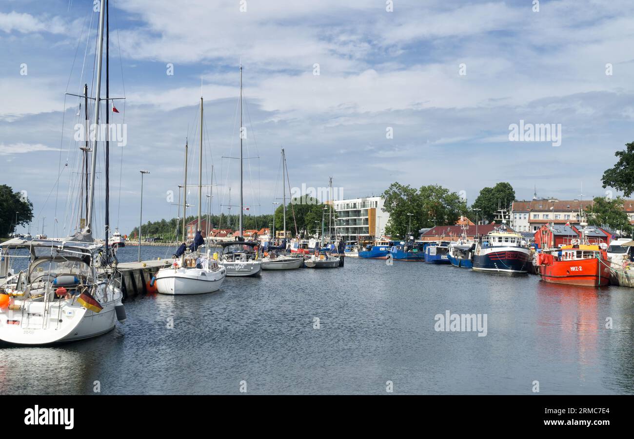 Fishing boats and yachts moored in the port of Mrzezyno, Western Pomerania, Poland, Europe. Fishery and yachting in the Baltic Sea. Stock Photo