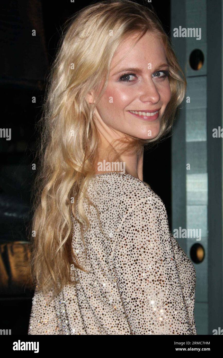 Poppy Delevigne attends the opening of Armani/5th Avenue in New York City February 17, 2009.  Photo Credit: Henry McGee/MediaPunch Stock Photo