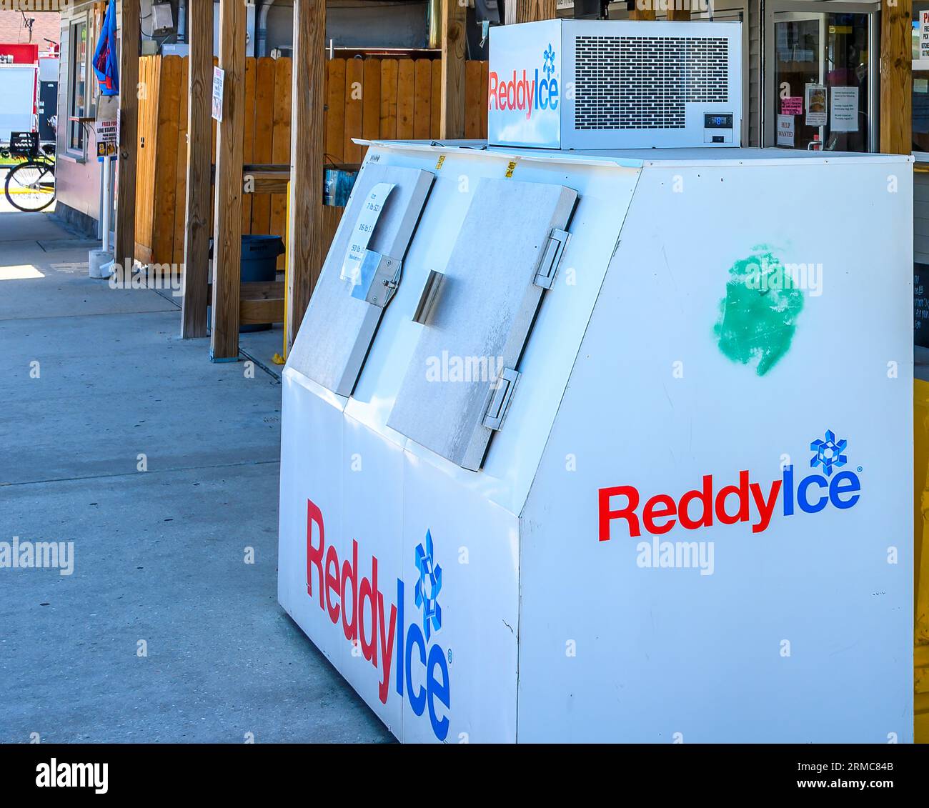 NEW ORLEANS, LA, USA - AUGUST 25, 2023: Reddy Ice packaged ice freezer box in front of restaurant in New Orleans East Stock Photo