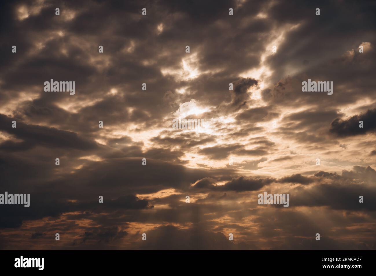 Sky with an incredible sunset and rays breaking through the clouds. Stock Photo