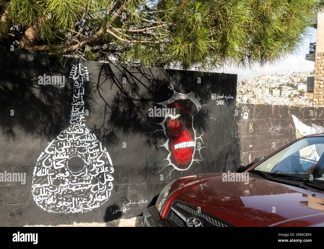 Murals in downtown Amman Traditional Arabic music instrument and face