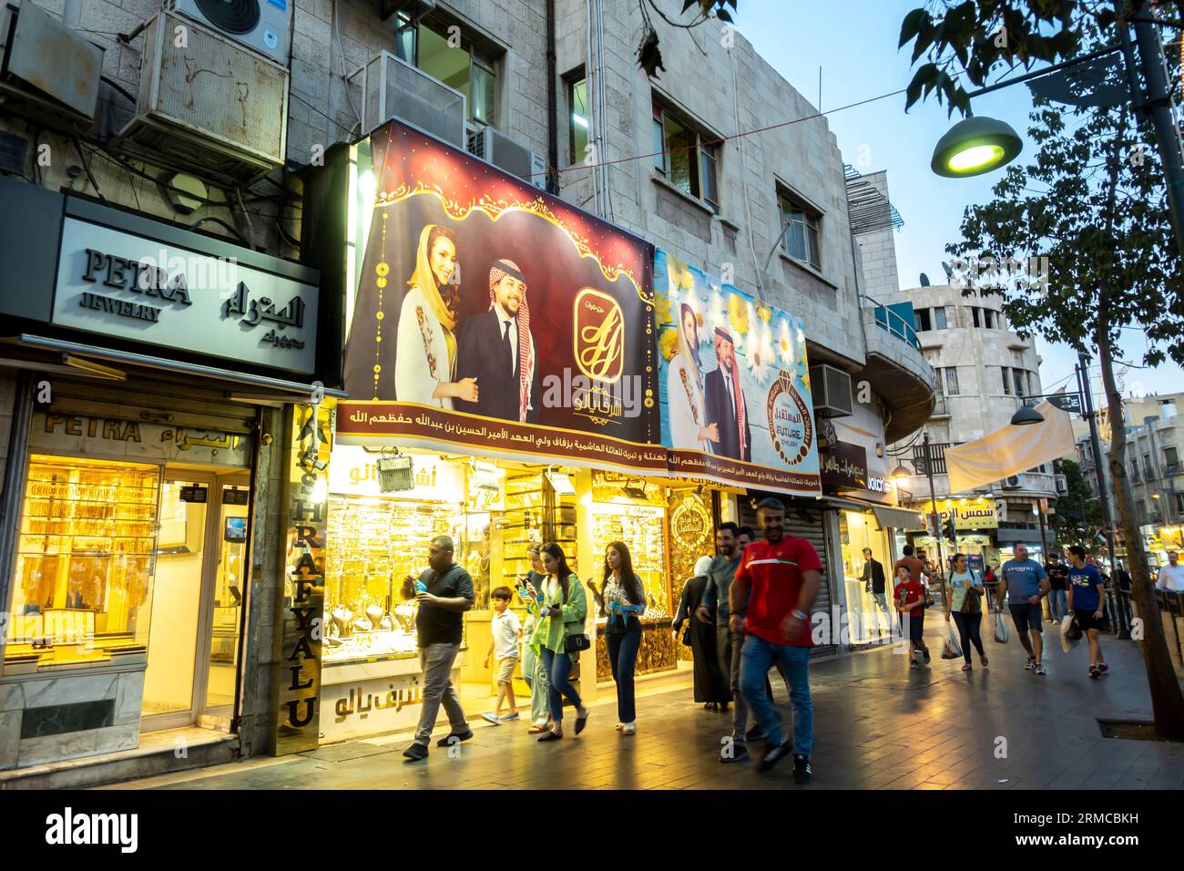 Tourists, locals walking on high street in Amman Jordan past Jewellry