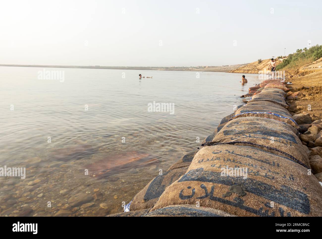 Safety bags on the rim of the shore of the Dead sea in Jordan Stock Photo