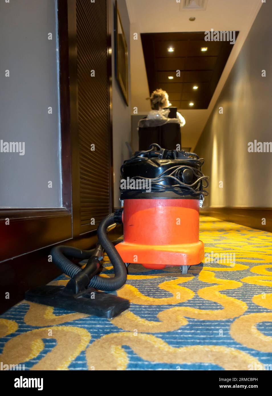 Vacuum cleaner station in a hotel corridor. Cleaning hospitality housekeeper's cleaner for carpets cleaning in hotels Stock Photo