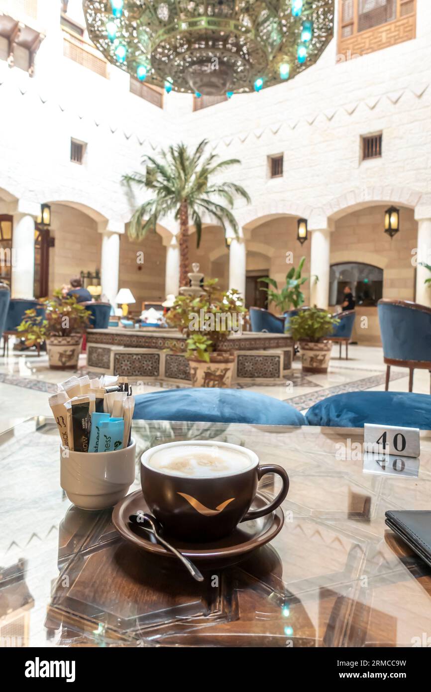 Cup of coffee in the lobby cafe bar in Mövenpick Petra hotel Stock Photo