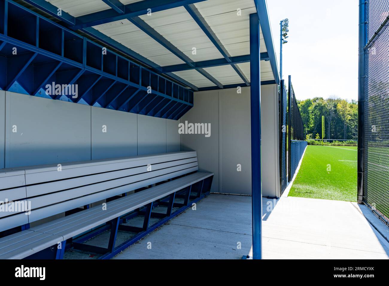typical nondescript high school baseball third base dugout. No people visible. Not a ticketed event. Stock Photo