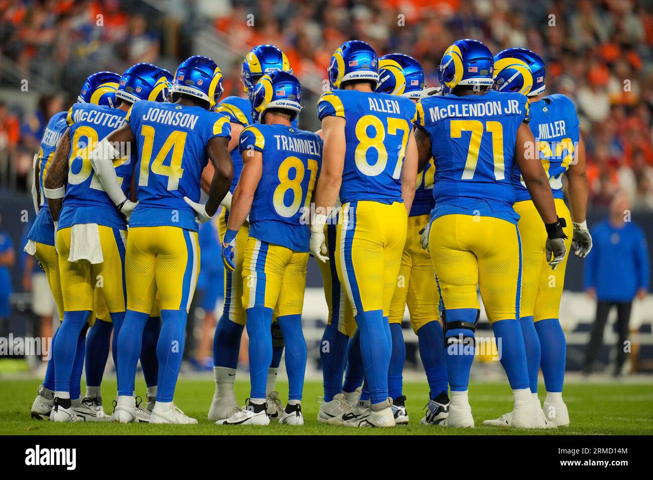 The Los Angeles Rams huddle during the first half of a preseason NFL  football game against the …