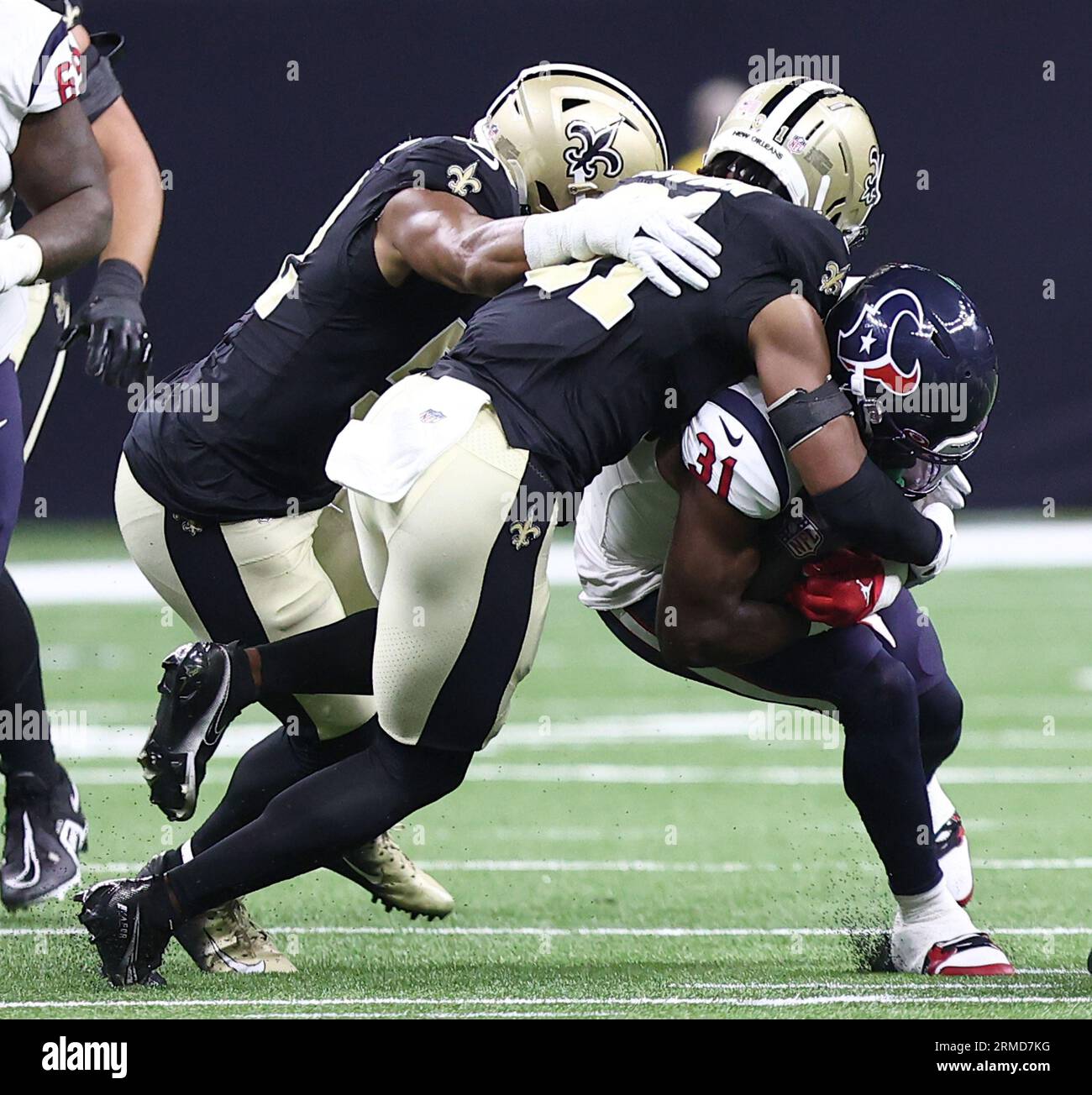 New Orleans, USA. 27th Aug, 2023. New Orleans Saints safety Jordan Howden  (31) tackles Houston Texans running back Dameon Pierce (31) during a  National Football League preseason game at the Caesars Superdome