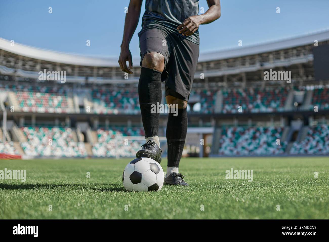 african american man holding a soccer ball in the stadium Stock Photo ...