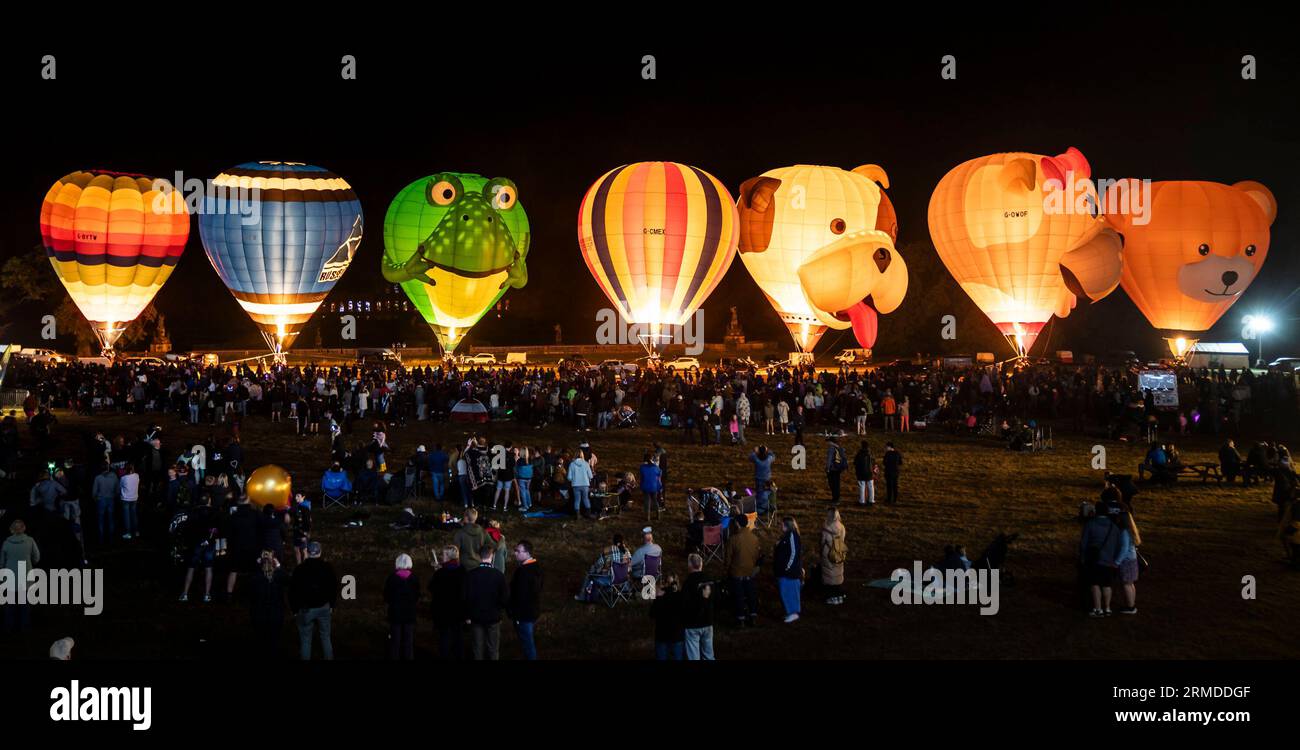 Balloons are illuminated during the Balloon Night Glow event, part of ...