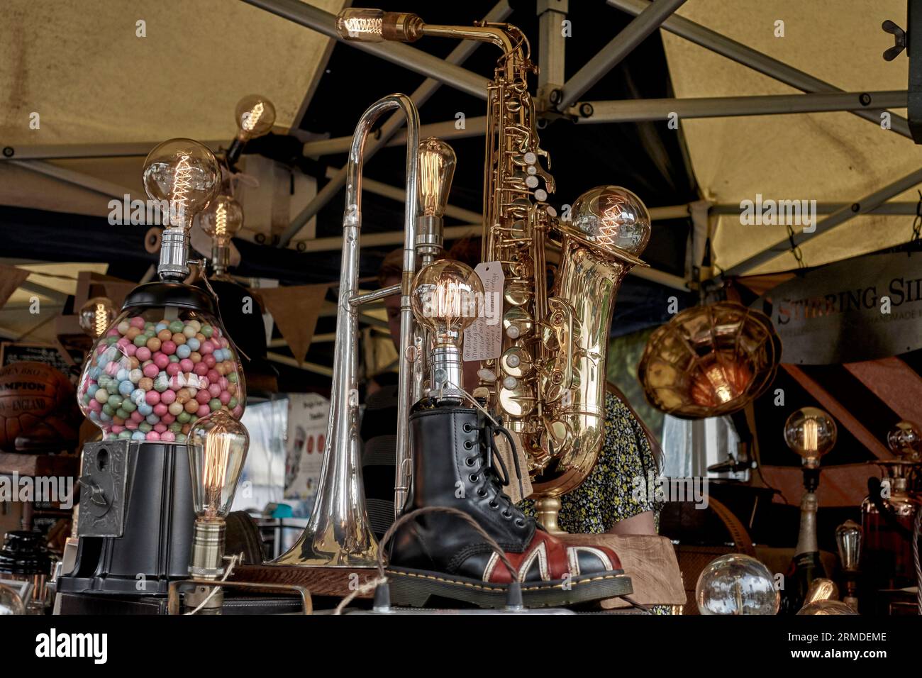 Unusual conversion of English vintage and antique items to provide household table lamp lighting. England UK market stall Stock Photo