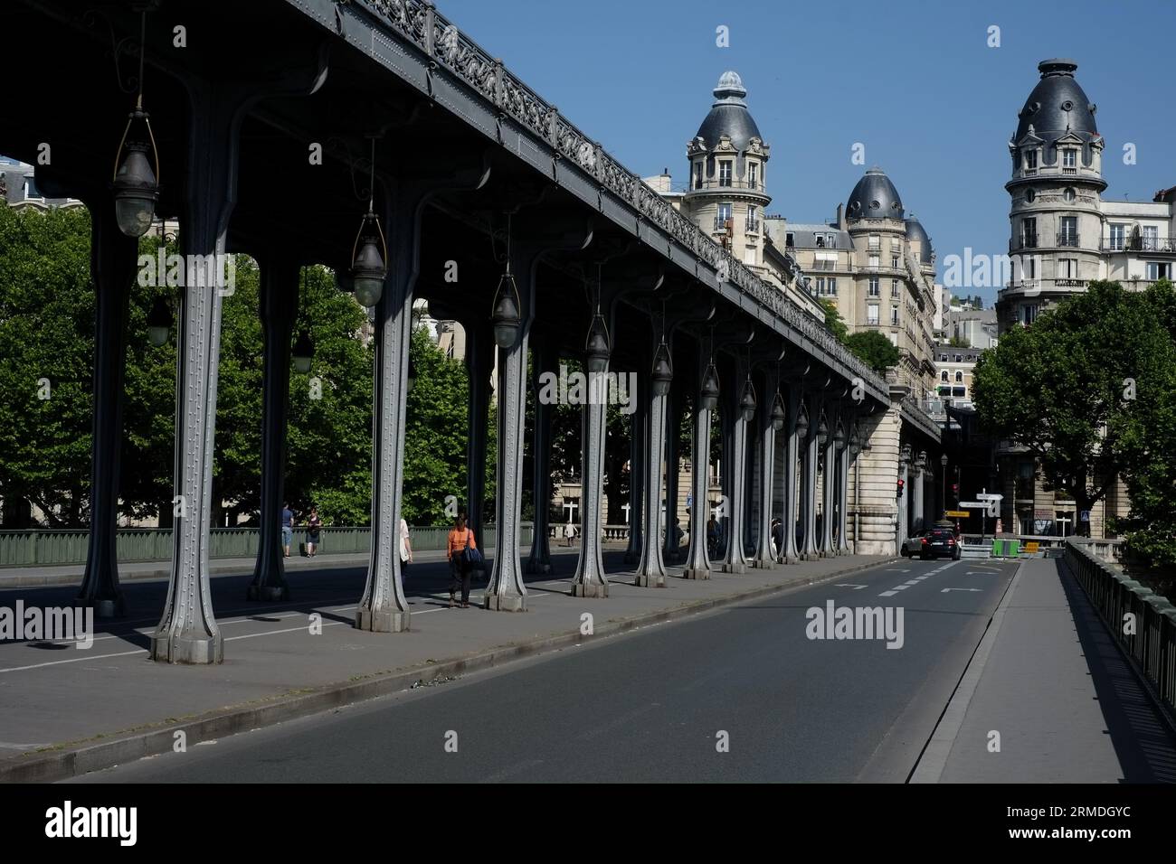 Ornate balustrade, pendant lamps & iron colonnade of the two-level bridge-viaduct Pont de Bir-Hakeim, looking toward Passy, Paris; France; Stock Photo