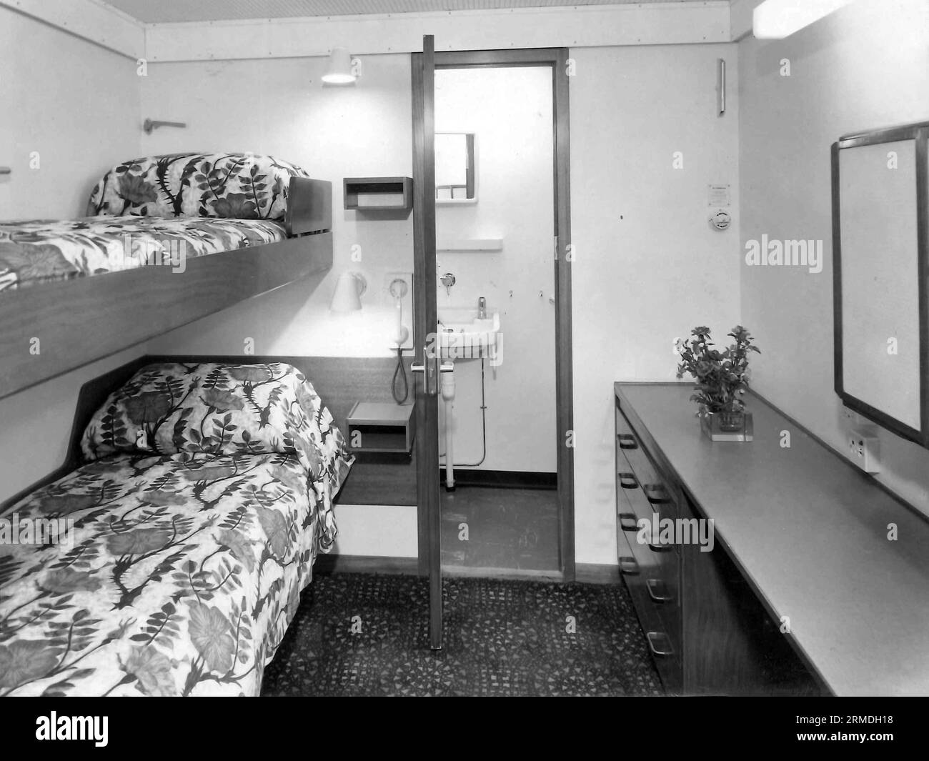 old vintage 1900s black and white picture first class two berth cabin with toilet on passenger ship India Stock Photo