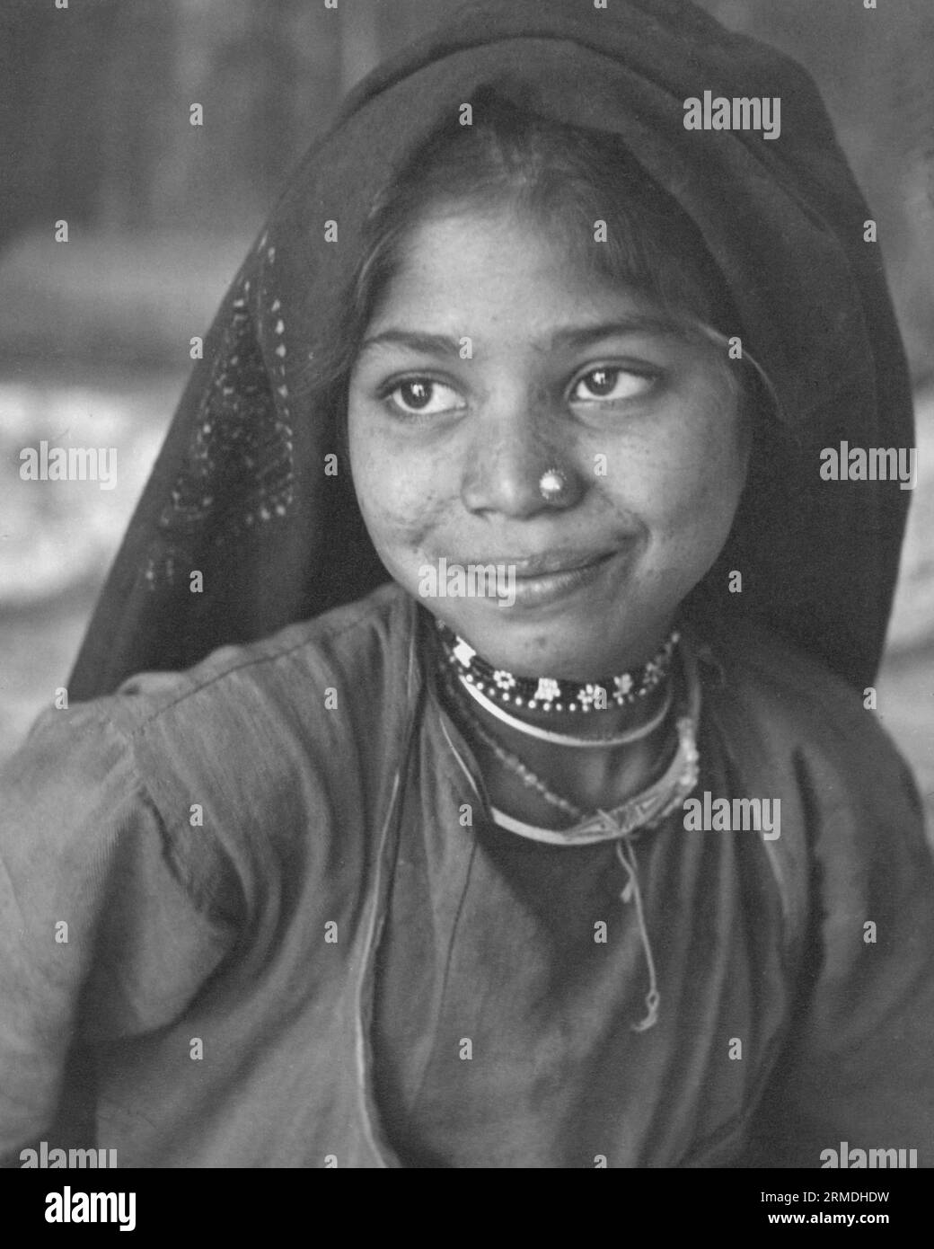 old vintage outdoor portrait black and white early 1900s silver gelatin toned print Indian woman India Stock Photo
