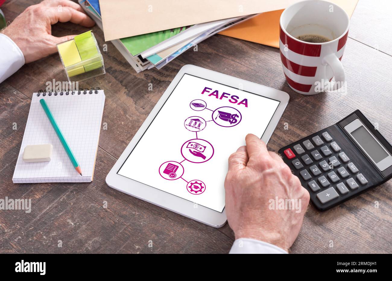 Man using a tablet showing a fafsa concept Stock Photo