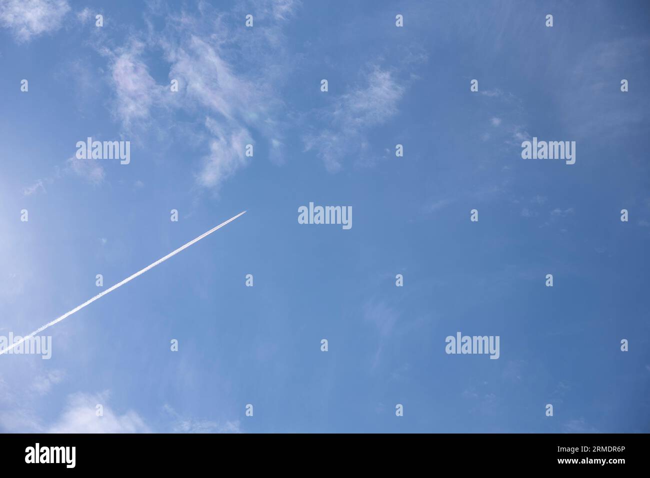 trace of the plane in blue sky Stock Photo - Alamy