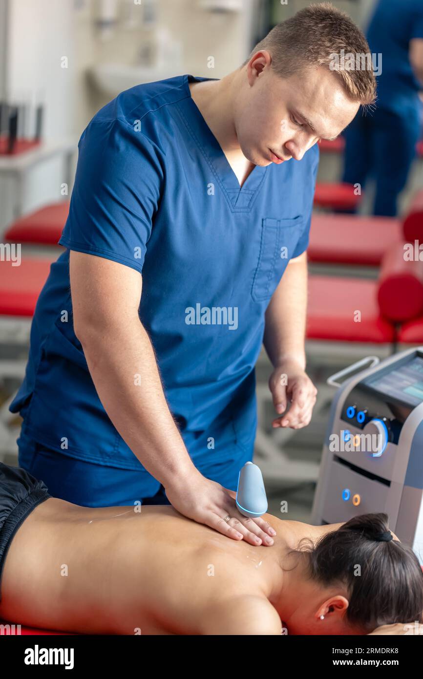 Physiotherapist using ultrasound machine hi-res stock photography and ...