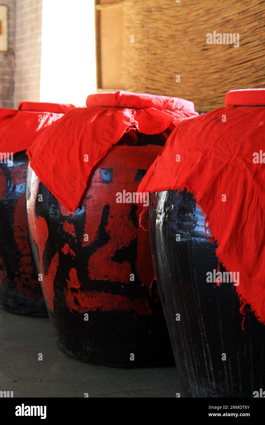 Wine in a cellar, Chinese traditional brewing process Stock Photo Alamy