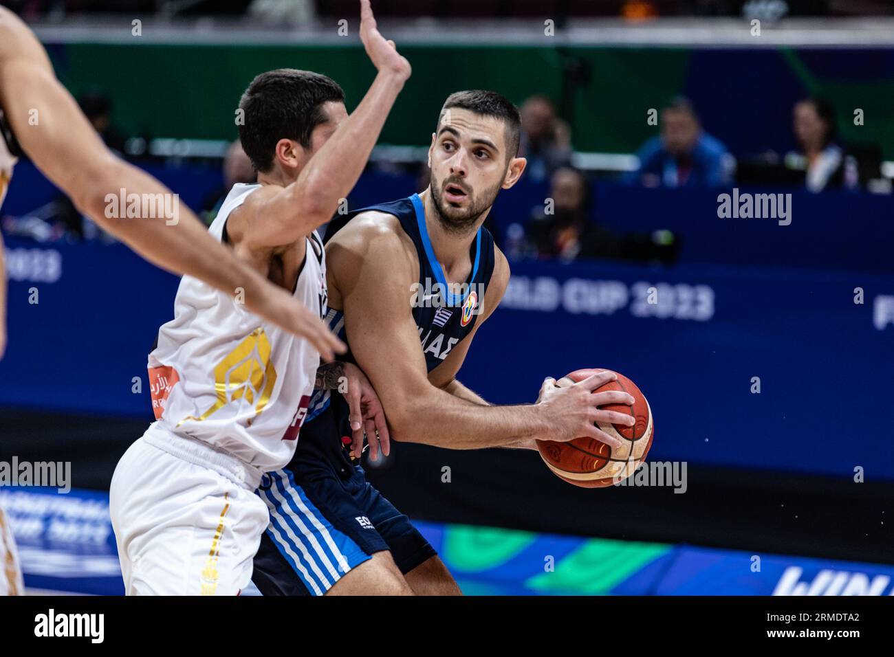 Manila Philippines. 26th Aug 2023. Ioannis Papapetrou R of Greece and Sami Bzai L of Jordan seen in action during the first game of the group phase of the FIBA Basketball World