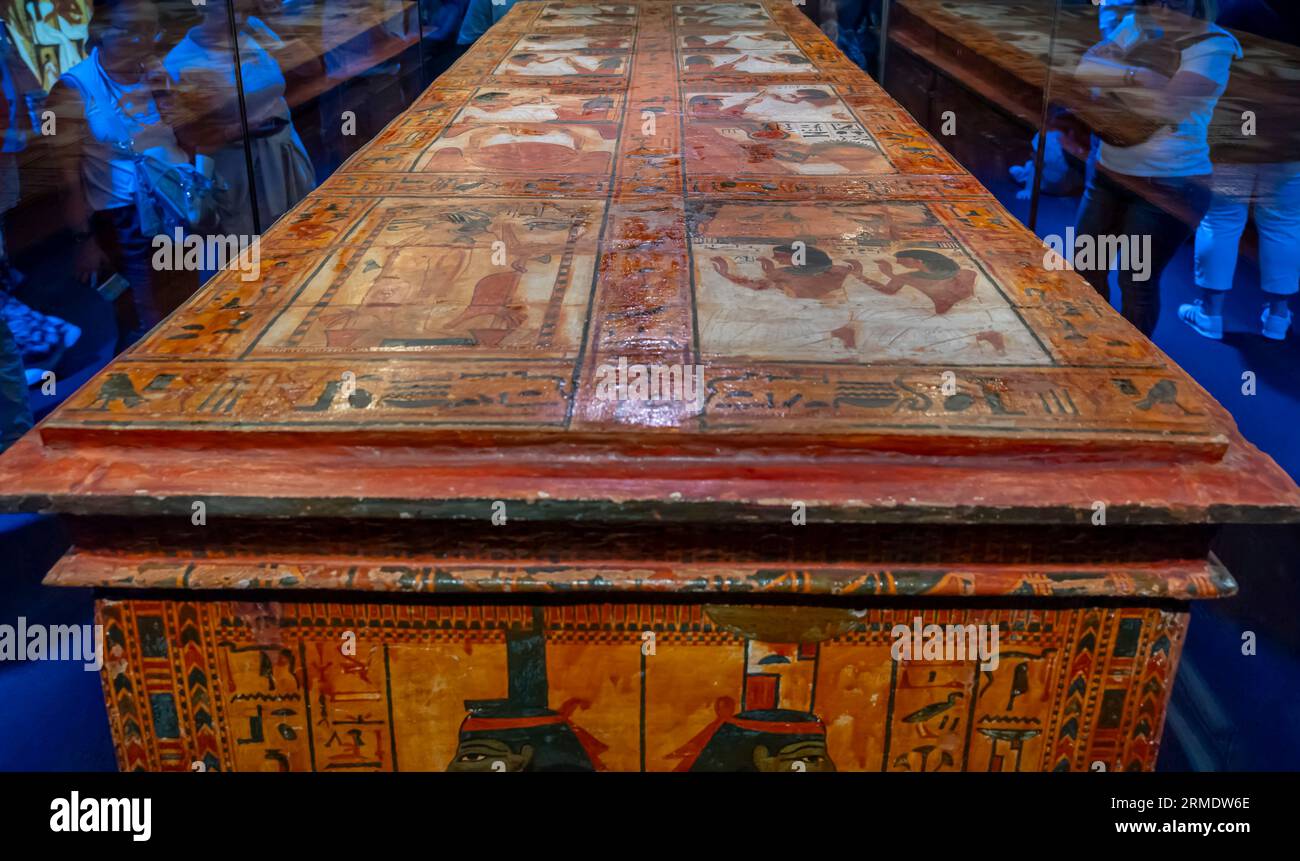 Paris, France - 08 22 2023: Ramses II the Great, Gold of the Pharaohs. Outer coffin of Sennedjem, with lid, on a wooden sledge Stock Photo