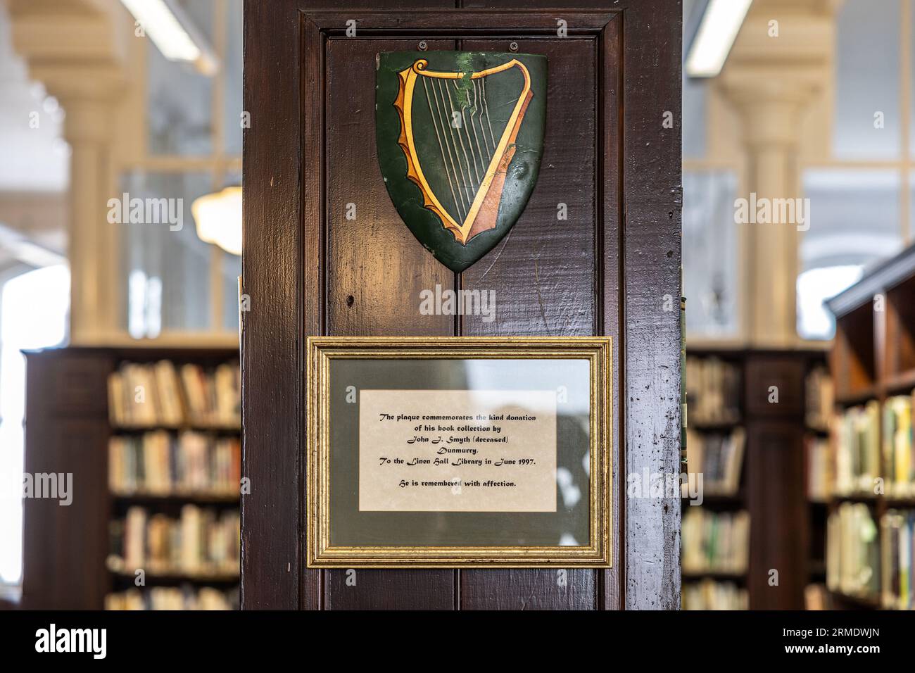 Commemorative plaque to John J. Smyth, Dunmurry, with green harp motif