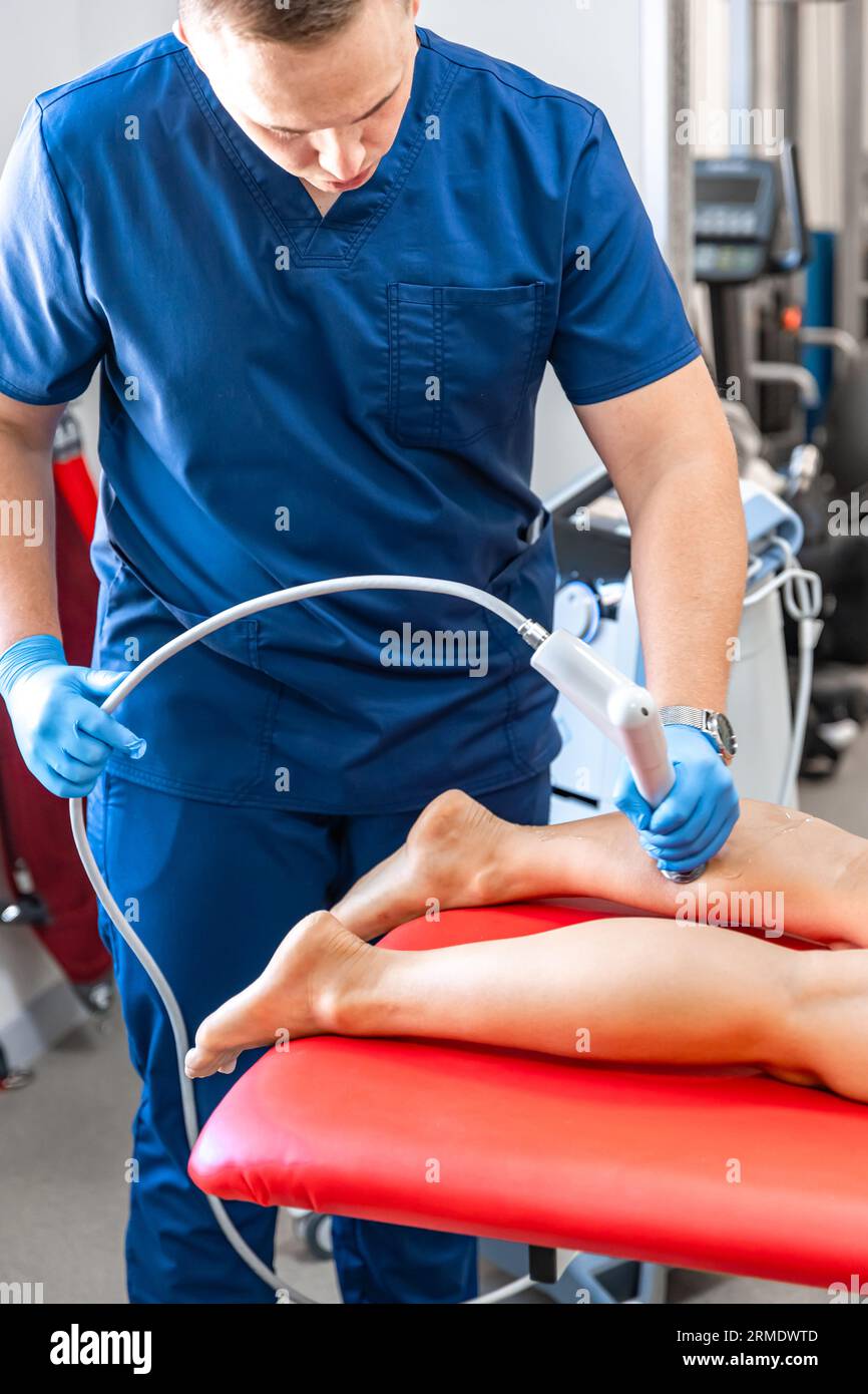 Extracorporeal Shockwave Therapy ESWT.Non-surgical treatment.Physical  therapy for neck and back muscles,spine with shock waves.Pain relief Stock  Photo - Alamy