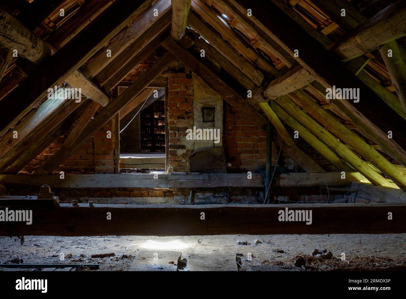 attic loft of typical 1950s built rural hungarian house with wooden beams tiled roof Stock Photo