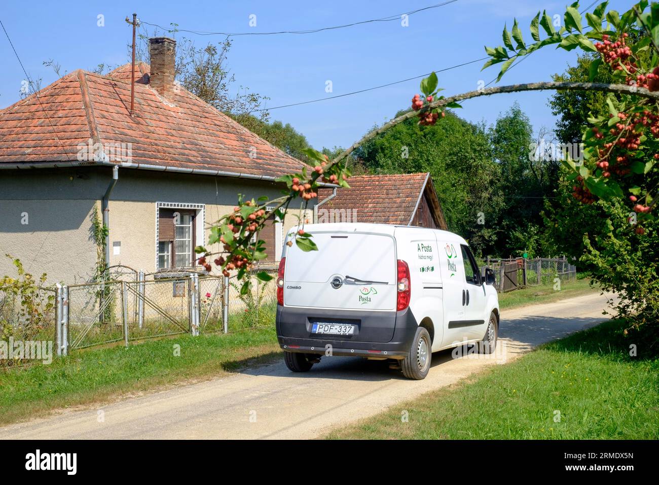 hungarian posta postal service mail delivery van rural countryside village lane hungary Stock Photo