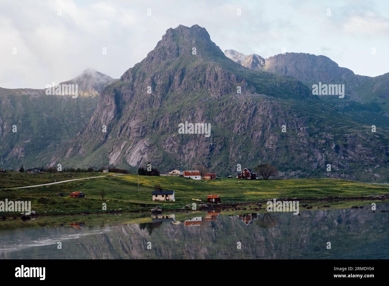 View of houses and mountains by the lake Stock Photo