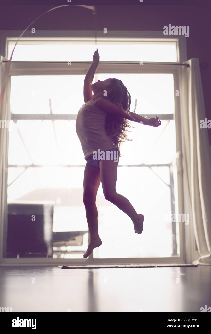 Elevated child dances with passion,  grace,  and strength Stock Photo