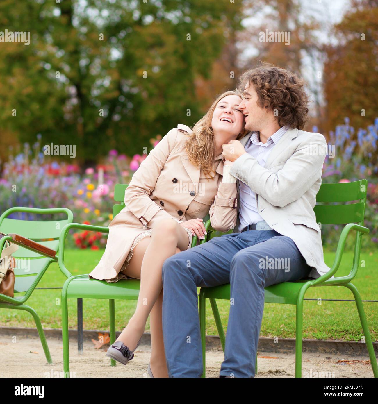 Romantic couple in a park, having a date Stock Photo - Alamy