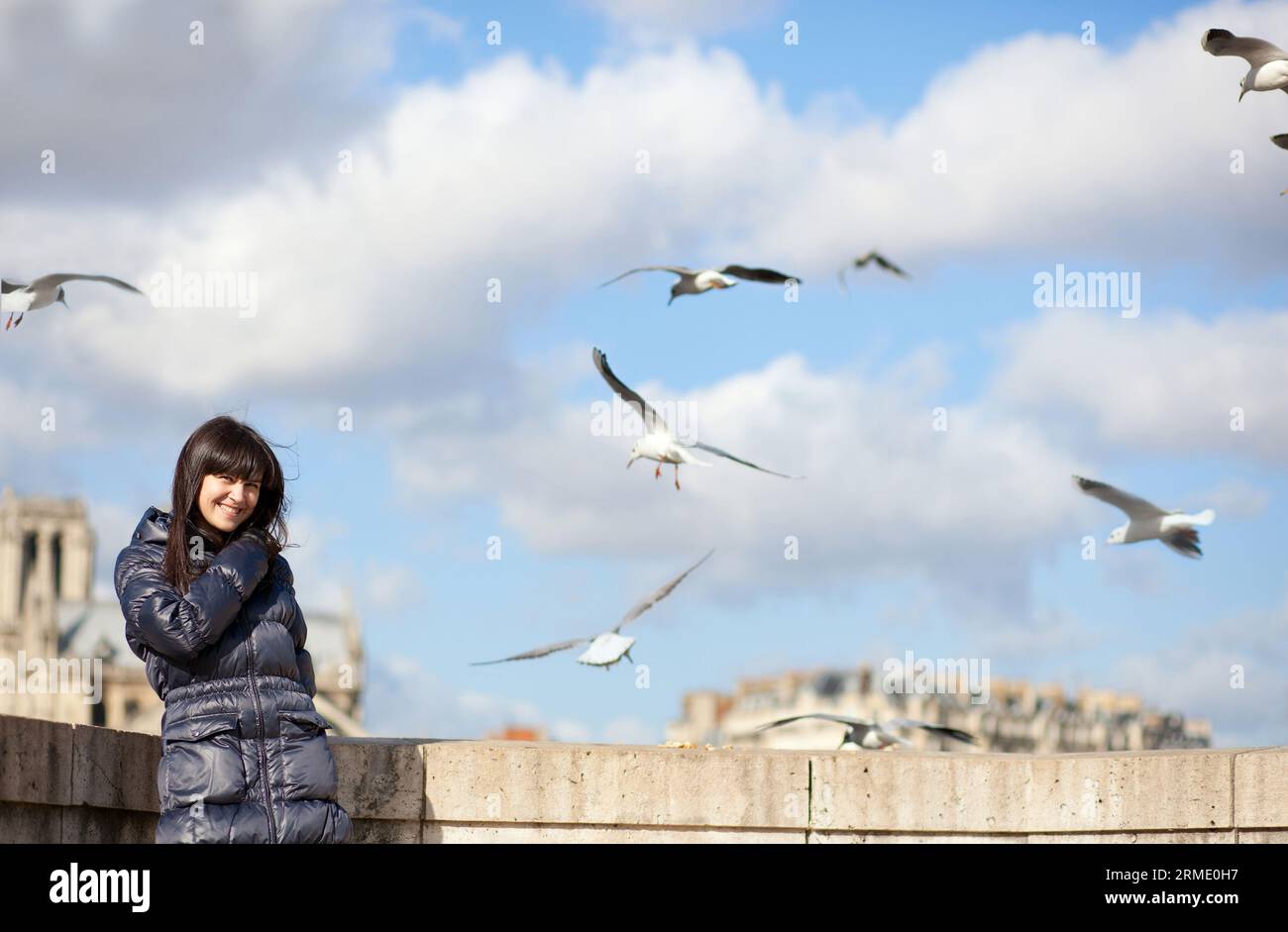 Windy Spring April Happy brunette girl in Paris enjoying windy spring day Stock Photo - Alamy