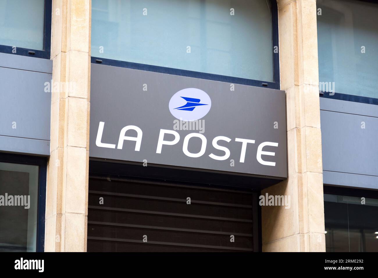 Metz, France - January 23, 2022: Entrance and signpost of French postal service and the Postal Bank in Metz, France. Stock Photo