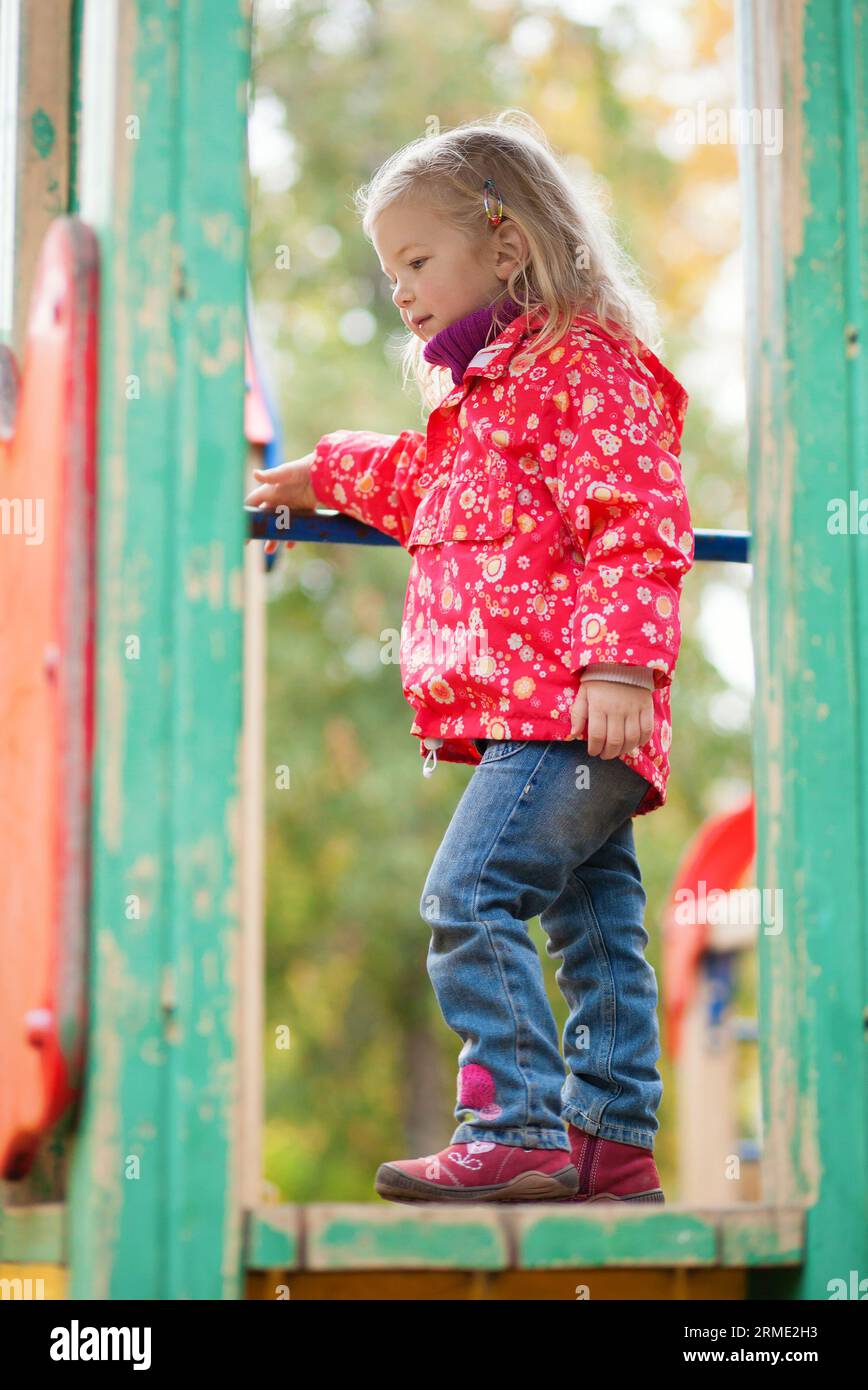 Beautiful little girl at the playground Stock Photo - Alamy