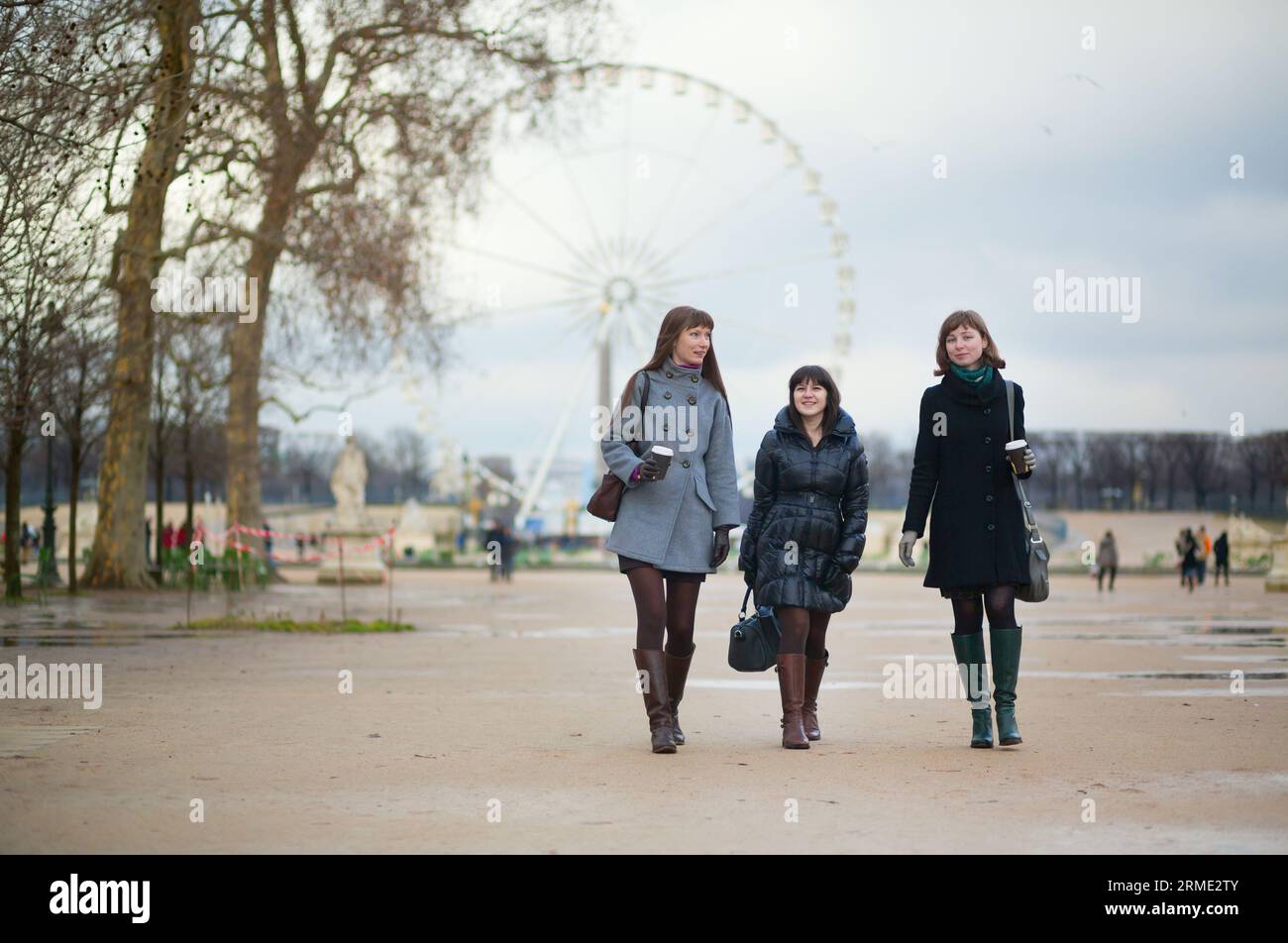 Three girls walking hi-res stock photography and images - Alamy