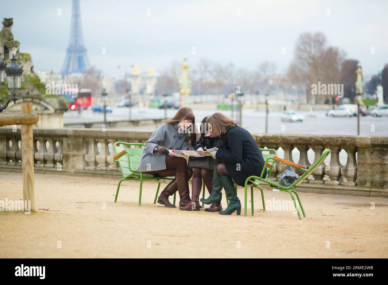 Tourists in Paris planning their trip using map Stock Photo