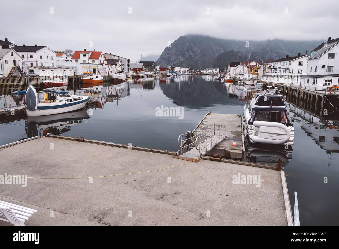 View of a pier and boats in a Norwegian village Stock Photo