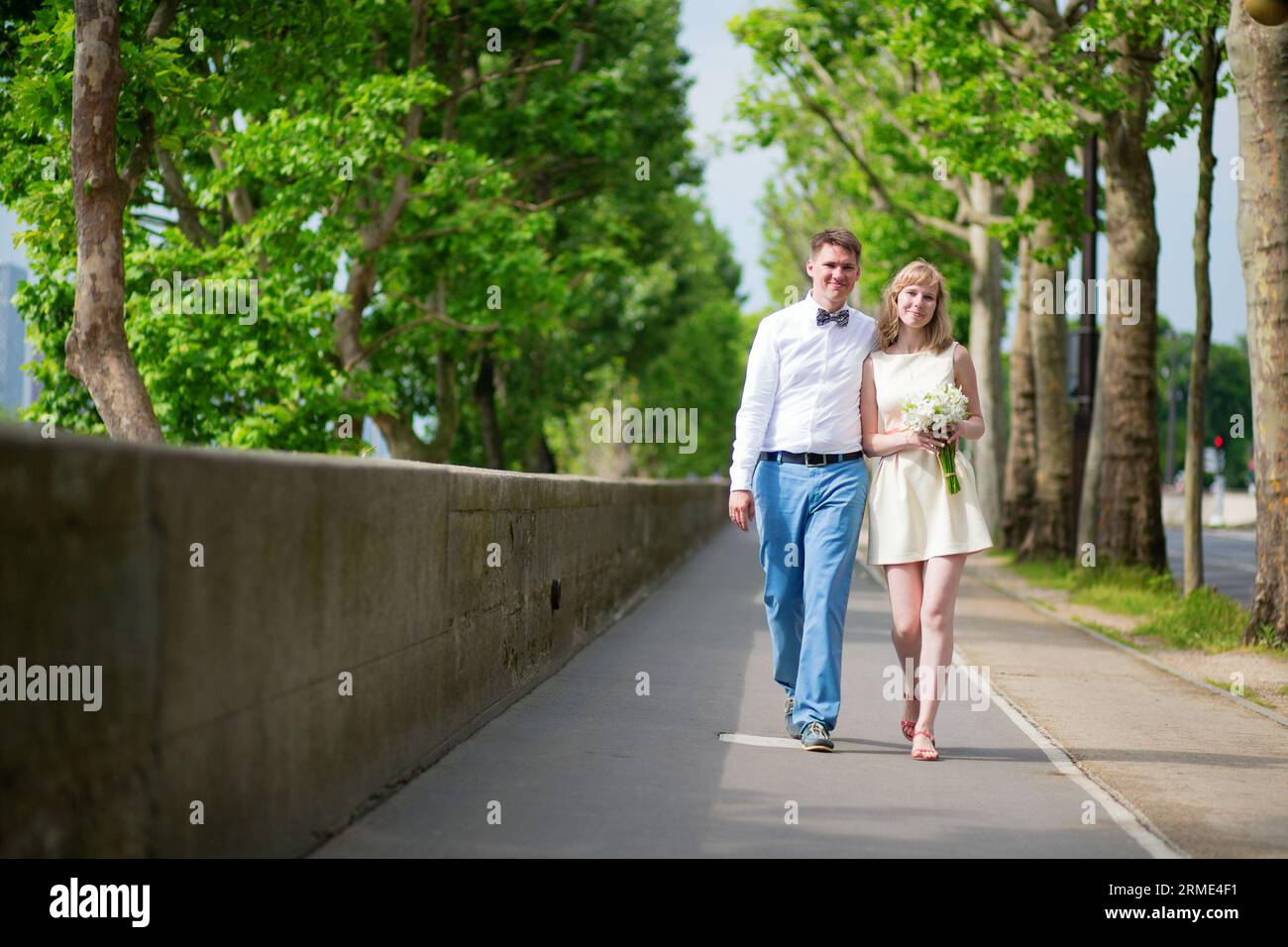 Newly-wed couple walking together in Paris Stock Photo